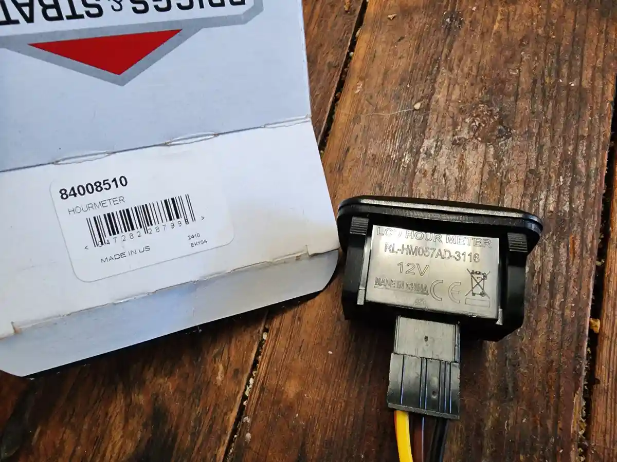 A close-up photo shows a black LCD hour meter with a label reading 'LCD HOUR METER RL-HM057AD-3116 12V MADE IN CHINA' next…
