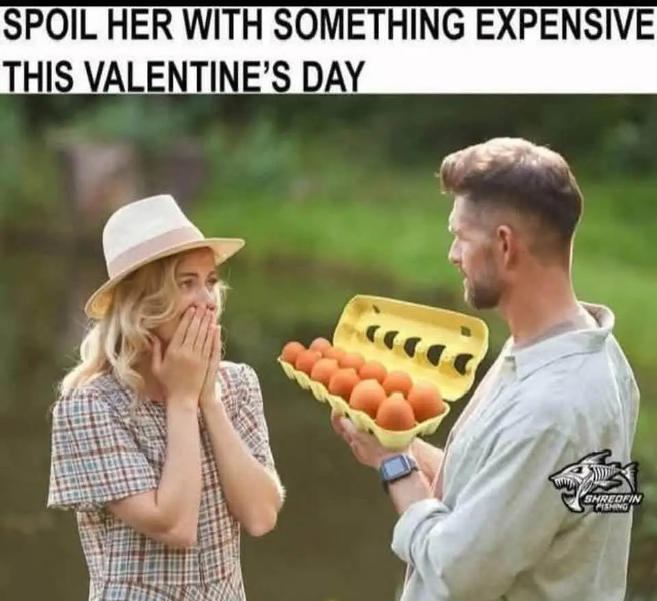 A man holds a yellow carton of eggs toward a woman wearing a plaid shirt and a white hat, who covers her mouth in shock. The…