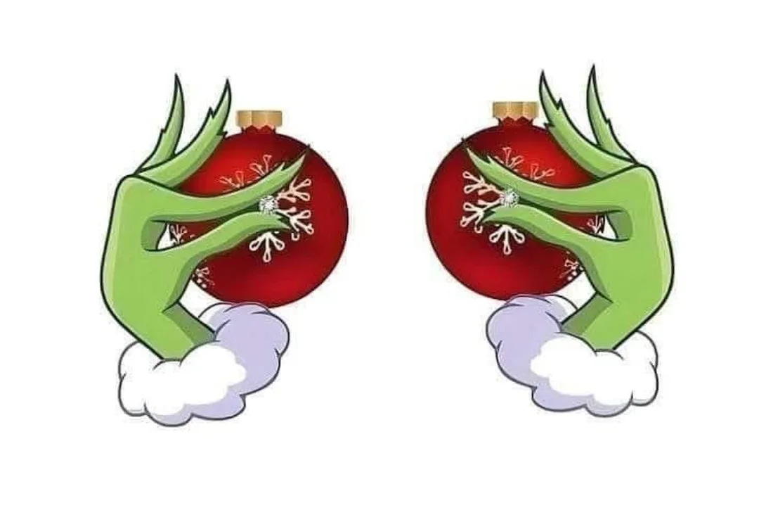 Two identical cartoon images show green, clawed hands holding red Christmas ornaments with snowflake designs, each hand…