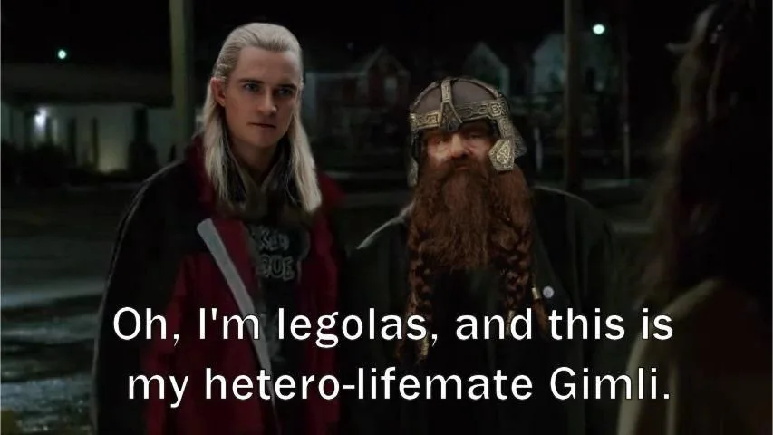 Two characters from 'The Lord of the Rings' stand side-by-side at night, Legolas with long blonde hair and Gimli with a…