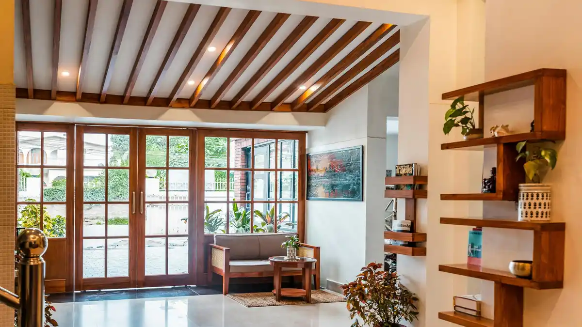 Warm wooden accents and minimalist decor harmonize beneath a kaleidoscope of natural light, casting a gentle glow on the…