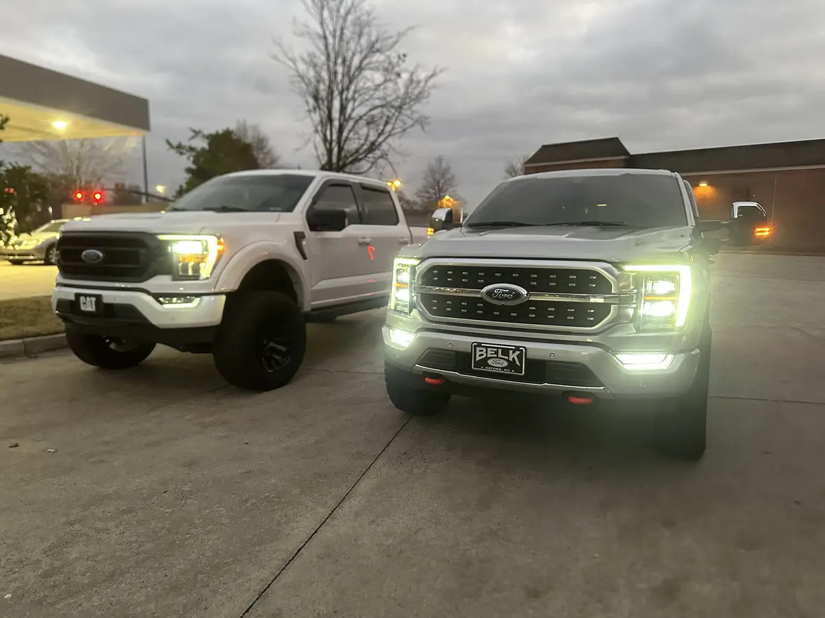 Check out my leveled 21 F150 Powerboost next to my friend's custom lifted 23 F150 with tunes and exhaust!