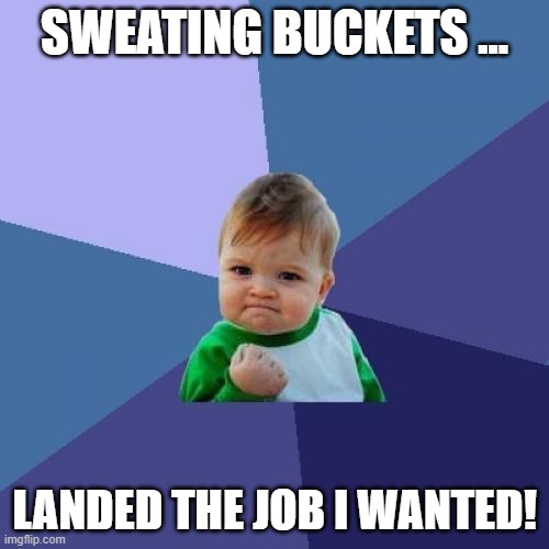 A baby with a smug, triumphant expression, wearing a green and white shirt, clenched fist raised, set against a geometric…