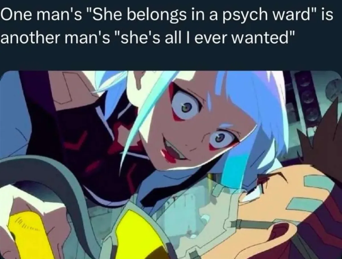An anime-style image shows a character with blue hair and wide eyes looking intensely at another character lying down, with…