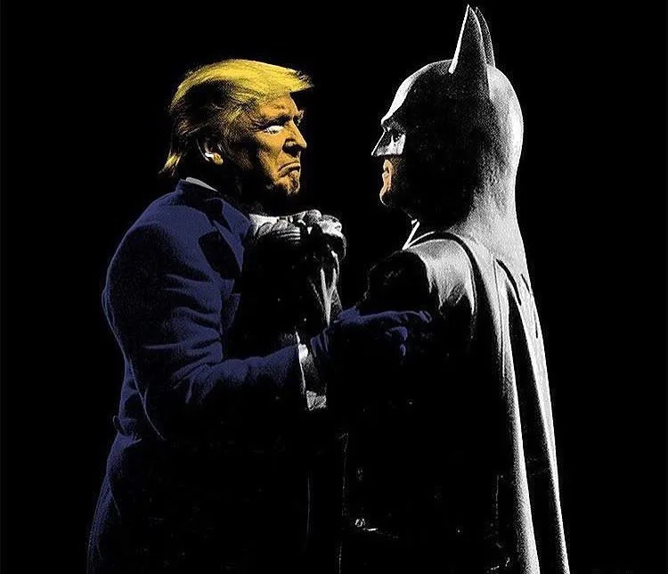A digitally altered image shows Donald Trump, with his signature blonde hair and beard, facing Batman in a dark, cinematic…