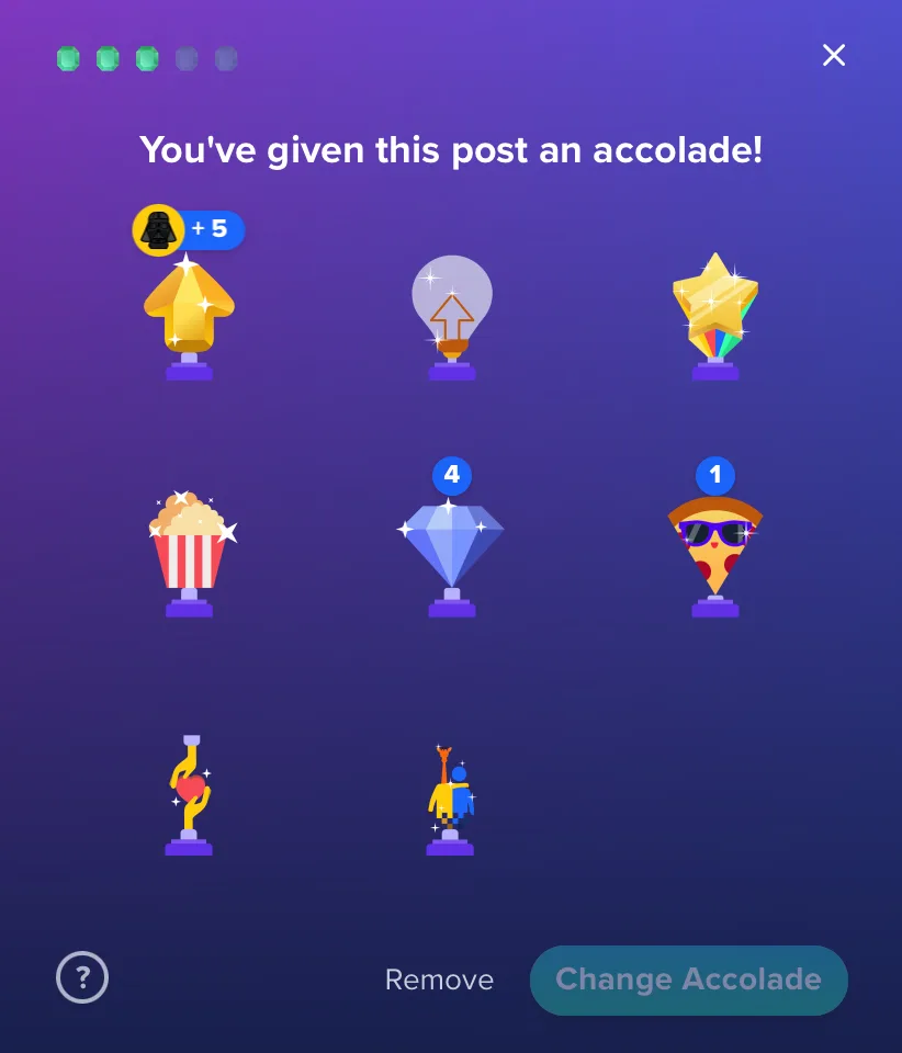 A purple gradient screen shows a grid of nine cartoon-style award icons, including a Darth Vader head with +5, a lightbulb…