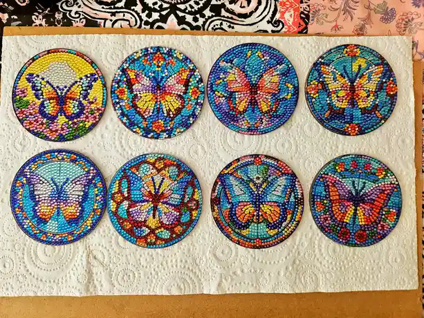 Beautifully crafted stained glass coasters featuring butterflies and flowers