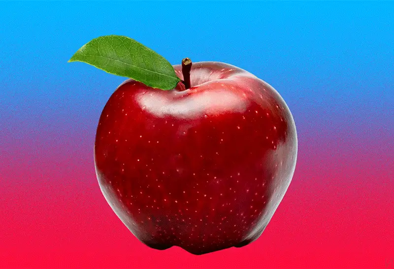The image shows three red apples against a blue-to-red gradient background. The first two apples are whole and identical…