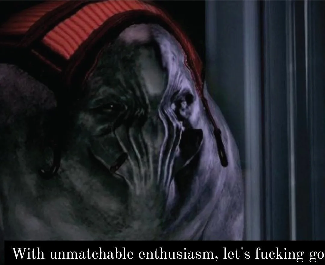 A close-up of a grotesque, alien-like creature with wrinkled, greyish skin and a red striped hat, looking intensely forward…