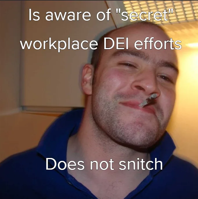 A man with a smug, self-satisfied expression, wearing a blue collared shirt, has a cigarette or similar object stuck in his…
