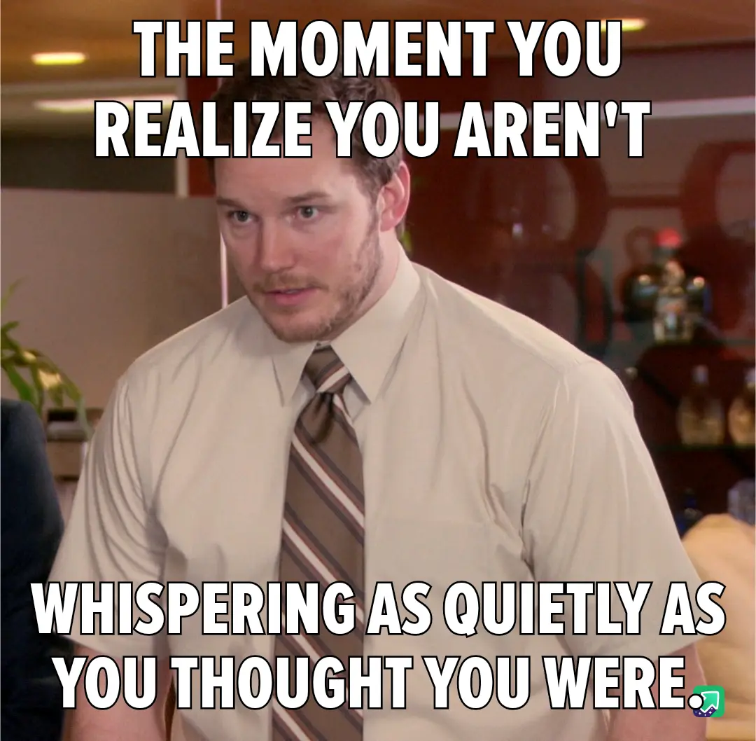A man in a beige shirt and striped tie looks surprised and slightly embarrassed, as if having just realized he's not as…