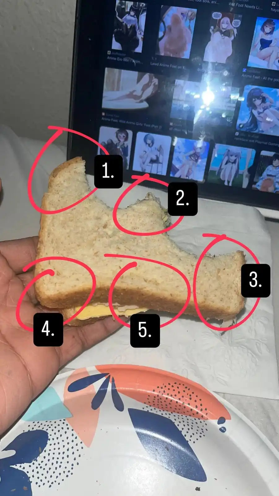 A hand holds a partially eaten sandwich with red circles highlighting five distinct bite marks on the bread. In the…