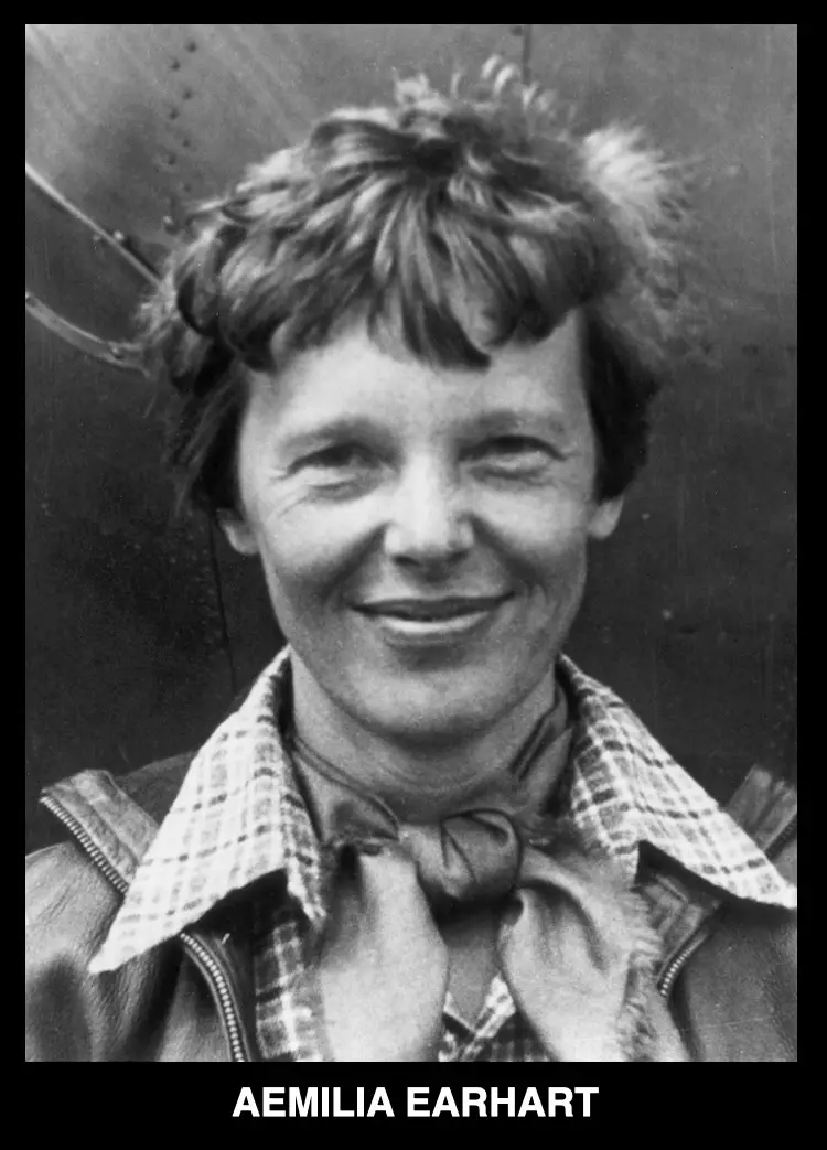 A black-and-white historical photograph shows a smiling woman with short, wavy hair, wearing a plaid shirt under a leather…