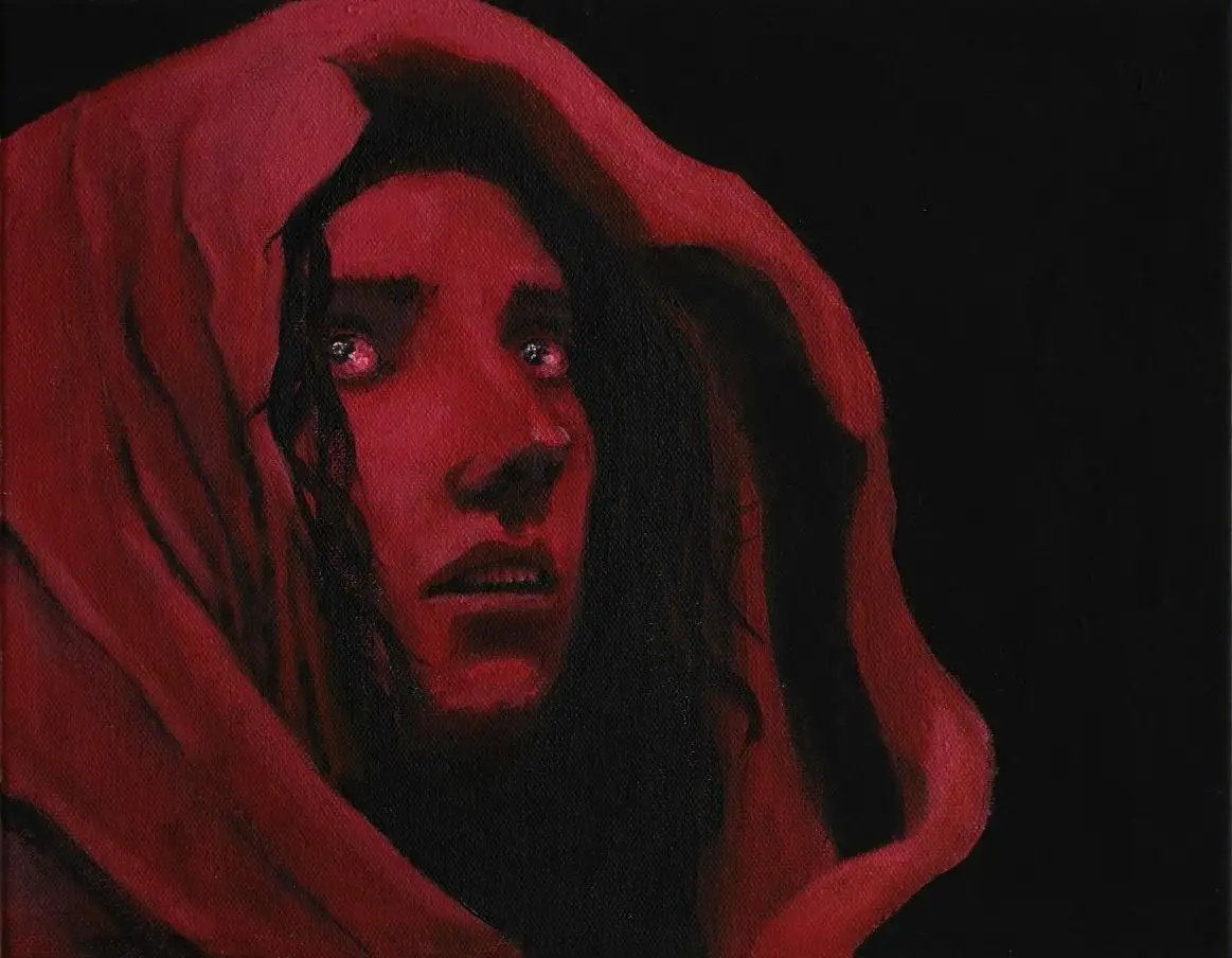 A painting depicts a person with long dark hair, wearing a red hooded garment, their face illuminated in red light against a…