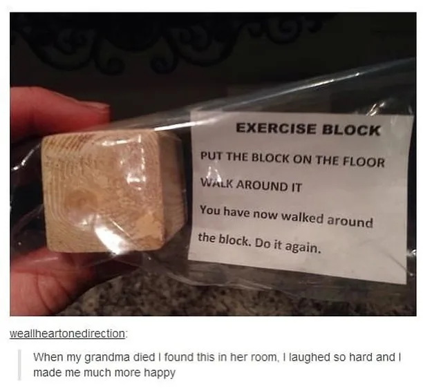 A hand holds a small wooden block in a clear plastic bag, with a printed label that reads 'EXERCISE BLOCK' and gives…