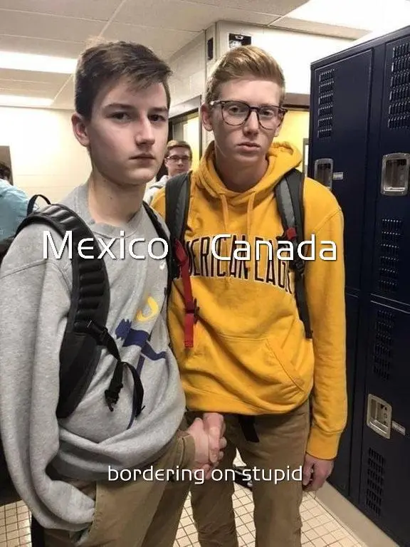 Two teenage boys stand in a school hallway holding hands, with text overlaid on their chests reading 'Mexico' and 'Canada'…
