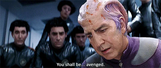 The image shows four panels of a Star Trek character, a bald man with purple skin and a scarred forehead, speaking the…