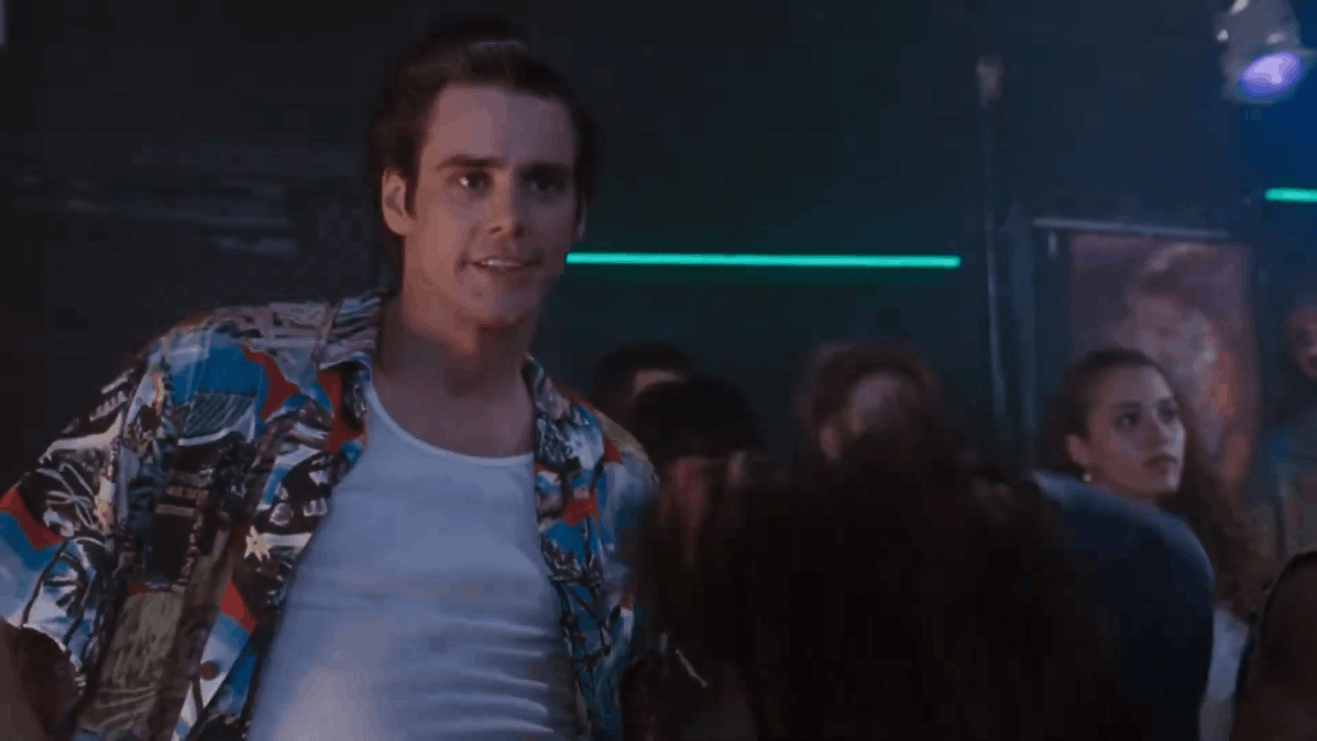A man in a colorful shirt smiles at a woman in a dark t-shirt with a skull graphic, then says 'Thank You' as she turns away…