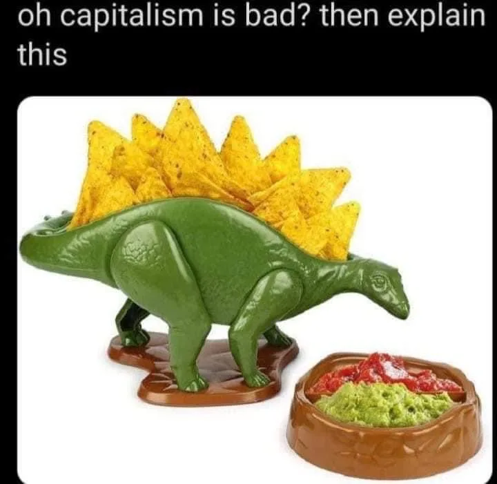 A green plastic dinosaur-shaped chip holder filled with yellow tortilla chips stands next to a matching brown bowl…