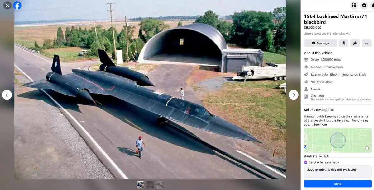 An aerial photo shows a black Lockheed SR-71 Blackbird spy plane parked on a paved road next to a large, curved hangar. The…