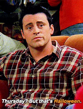 Six identical panels show the character Joey Tribbiani from 'Friends' sitting on a couch, wearing a red and beige plaid…