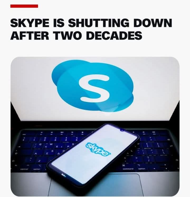 An image shows a laptop screen displaying the Skype logo, with a smartphone showing the Skype app resting on the keyboard…