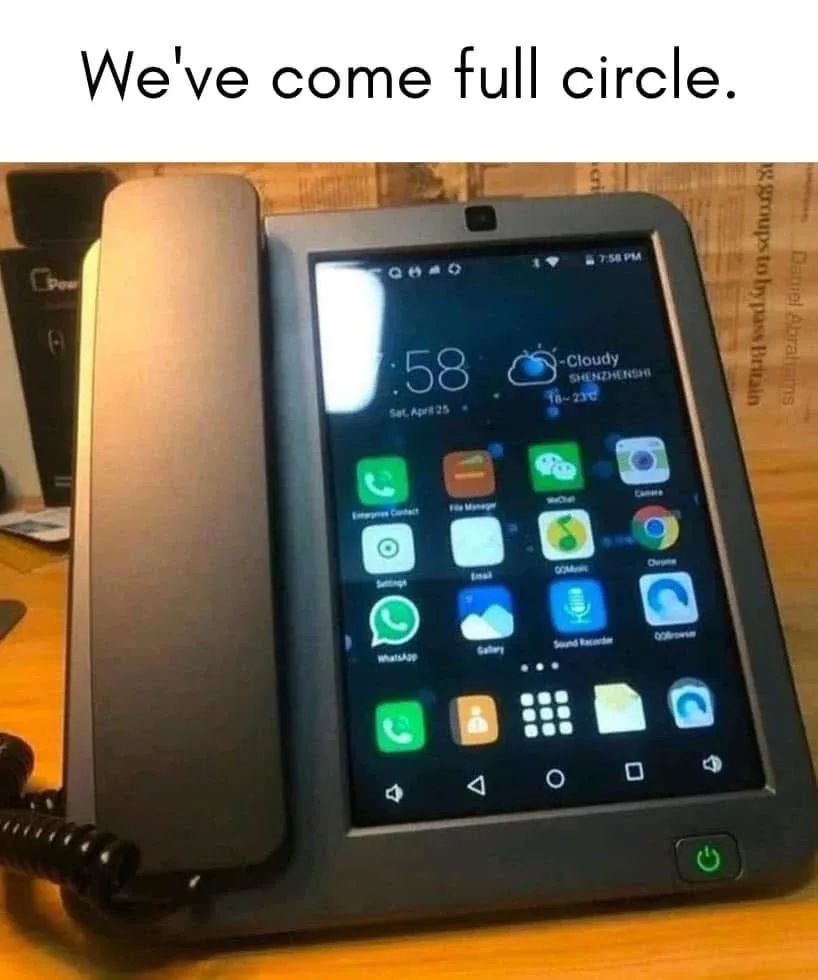 A modern smartphone with a physical handset attached, resembling a traditional landline phone, displays a typical Android…