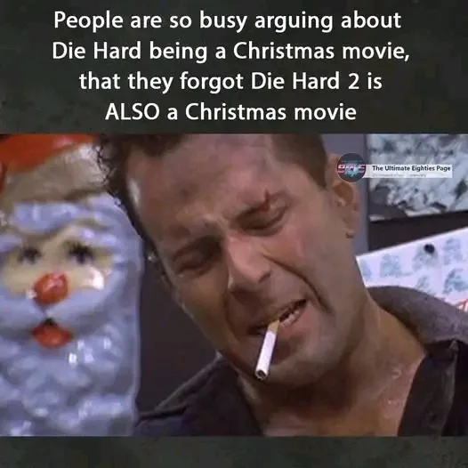A man with a cigarette in his mouth and a pained expression looks at a plastic Santa Claus figurine. The text overlay reads…