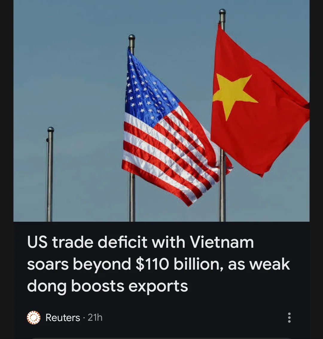 The image shows the flags of the United States and Vietnam waving side by side against a clear sky. Below the flags, a news…