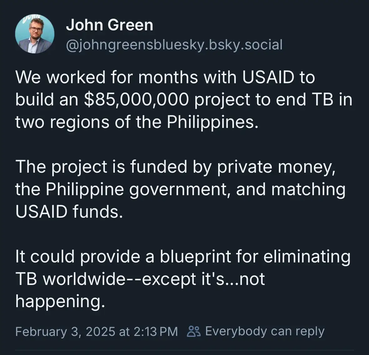 A screenshot of a Bluesky social media post by John Green, detailing a large-scale $85 million tuberculosis eradication…