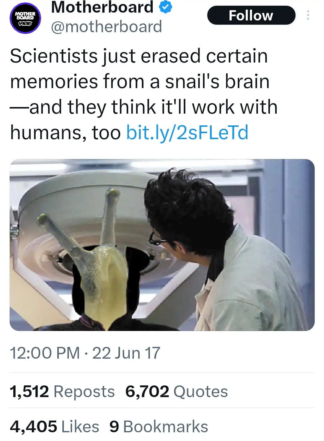 A person in a lab coat is shown from behind, looking at a large medical scanner. A snail is humorously placed inside the…