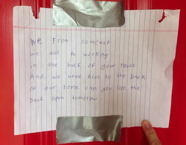 A handwritten note on lined paper, taped to a red surface with duct tape, reads a humorous message from 'Comcast' asking for…