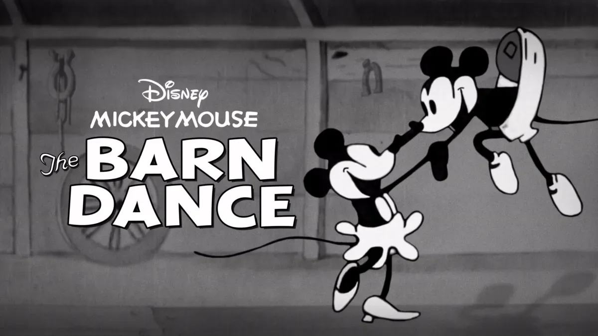 A black-and-white still from Disney's 'Mickey Mouse: The Barn Dance' shows Mickey Mouse dancing with a female mouse…