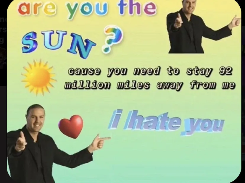 A meme image features a man in a black suit pointing at the viewer with a red heart floating beside him, overlaid with text…