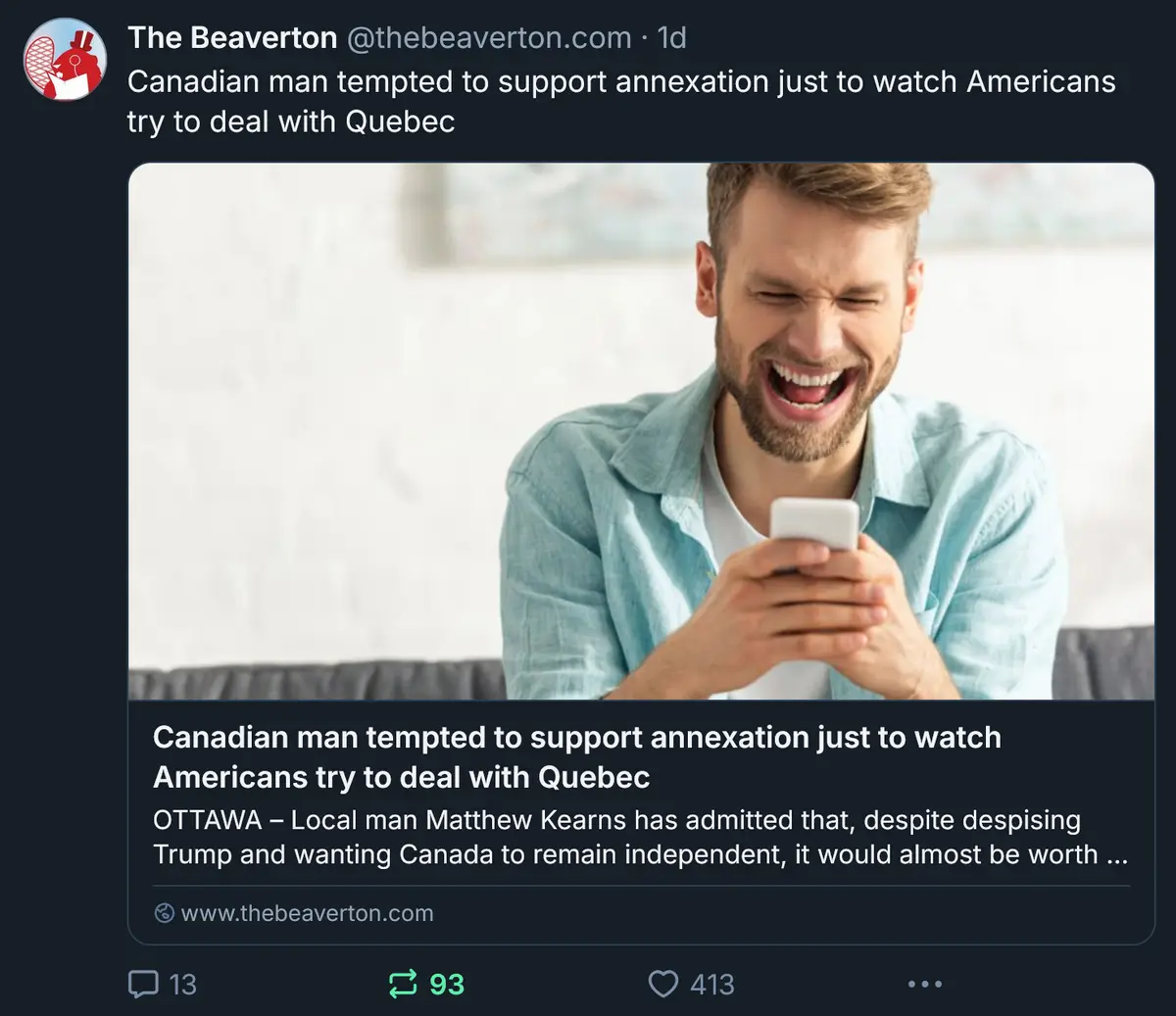 A man with a beard and light blue shirt laughs hysterically while looking at his phone, overlaid with text from a fake news…