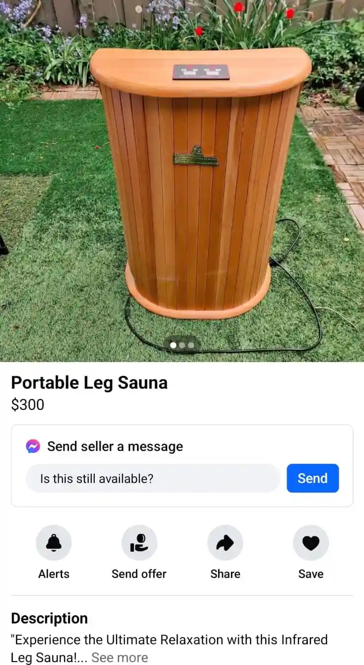 An image of a wooden, barrel-shaped portable leg sauna sitting on green grass, with a black power cord trailing from it…