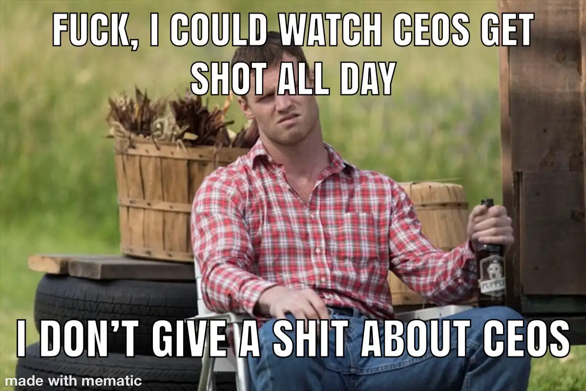 A man in a red plaid shirt sits in a folding chair outdoors, holding a beer bottle, with a bored or disinterested…