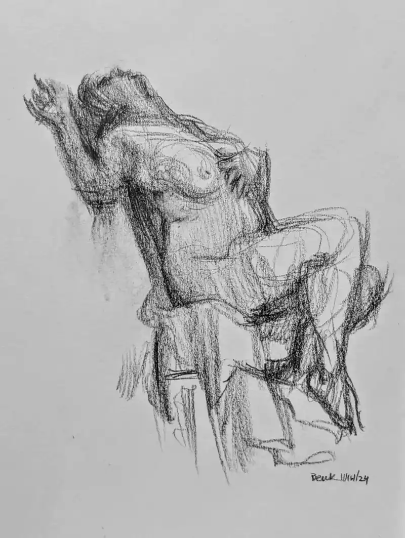 A rough charcoal sketch of a nude human figure slumped over in a chair, arms raised and head tilted back, conveying…