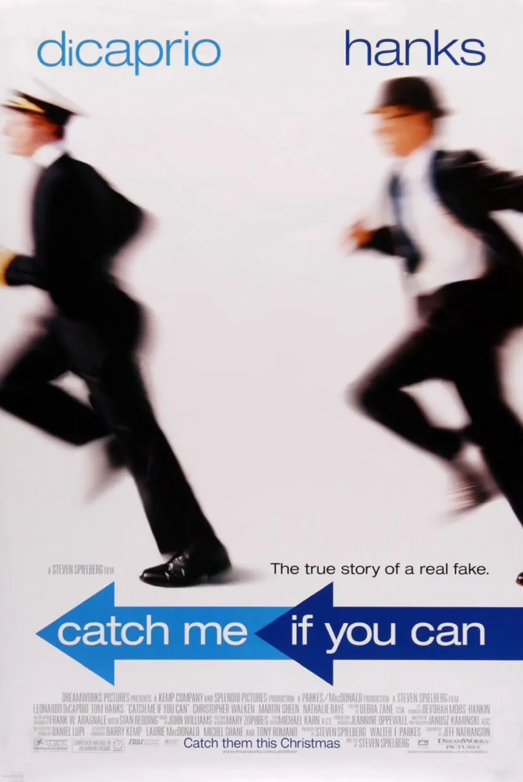 This is a movie poster for 'Catch Me If You Can' featuring Leonardo DiCaprio and Tom Hanks in motion blur, running in…