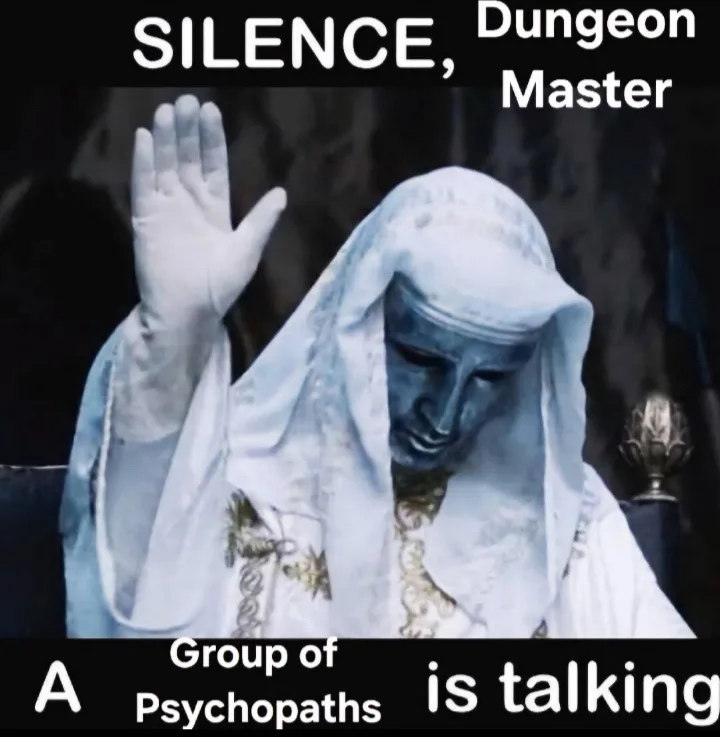 A statue of a robed figure with a blue face and white hood raises one hand in a commanding gesture. White text overlays the…
