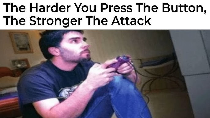 A man with dark hair and a goatee, wearing a dark t-shirt and jeans, is intensely focused while holding a purple video game…