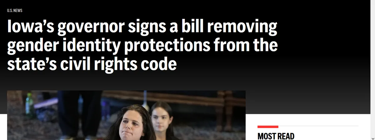 The image shows a screenshot of a U.S. News article headline about Iowa's governor signing a bill to remove gender identity…
