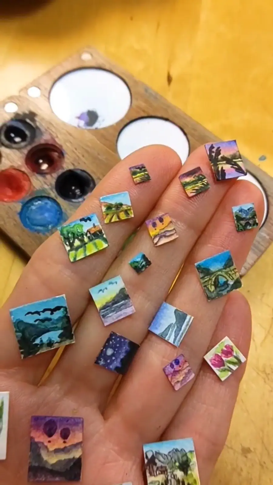 Check out my tiny watercolor paintings, each the size of a grain of rice!