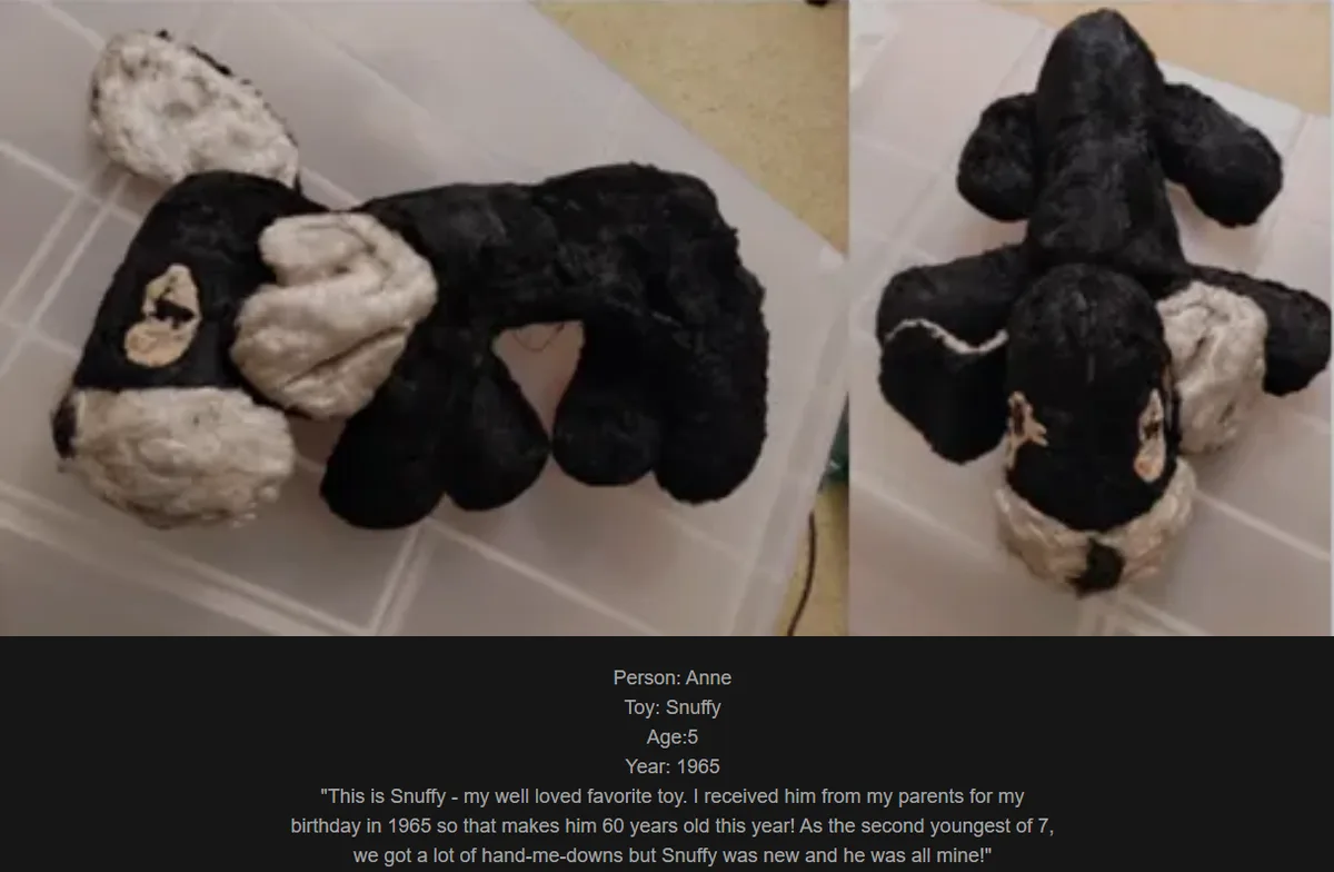 The image displays a worn, black-and-white stuffed dog toy named Snuffy, shown from two angles inside a clear plastic…