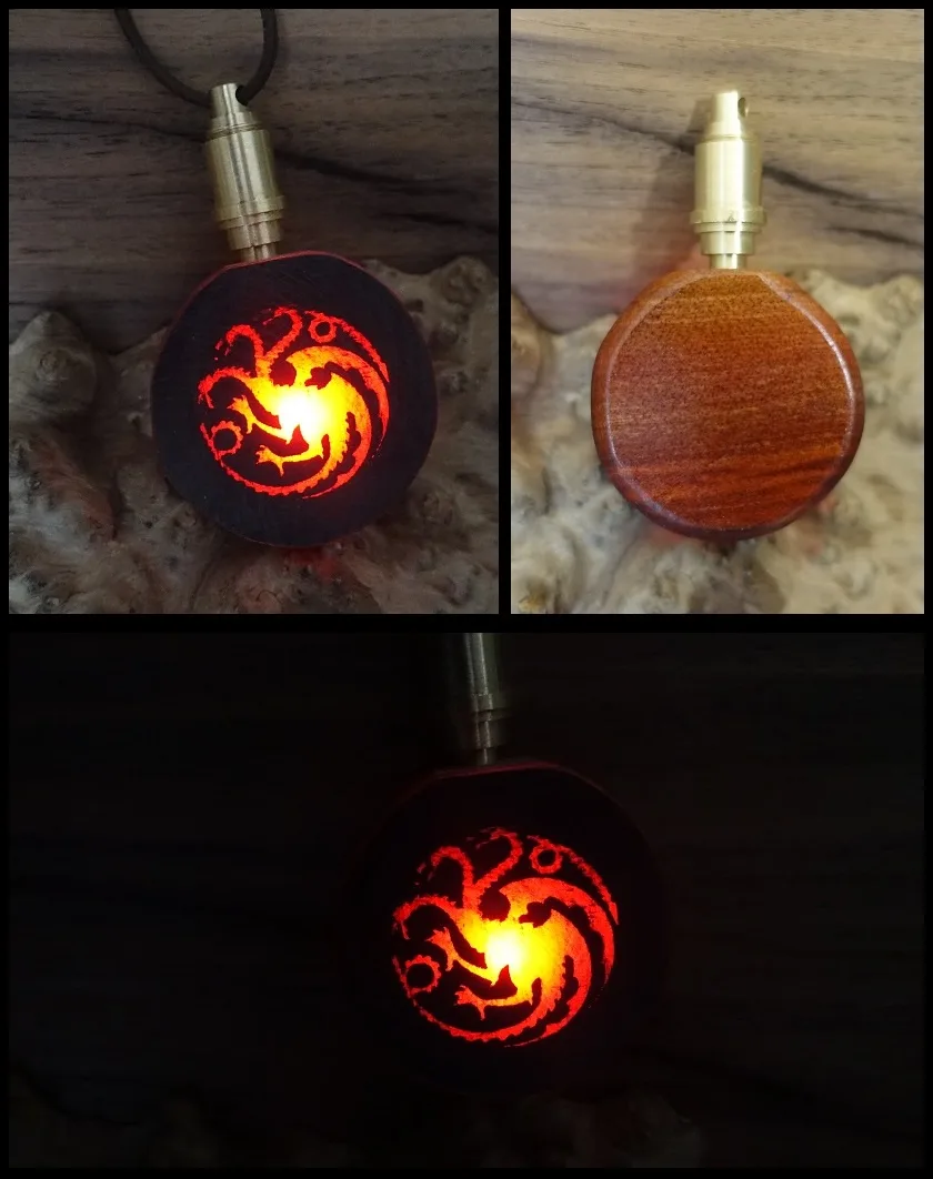 Three images show a wooden pendant with a brass clasp: one lit up glowing red with a dragon sigil, one showing the plain…