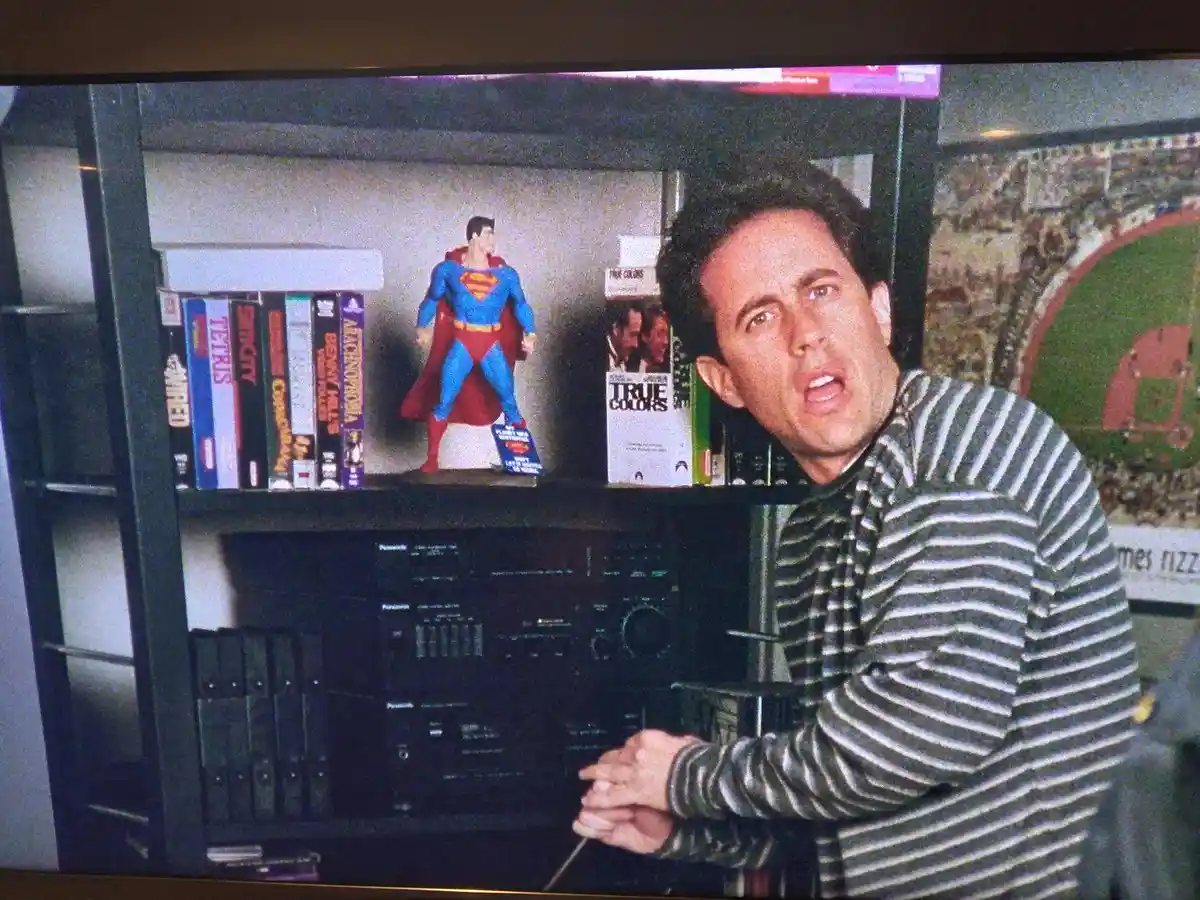 A still image from the TV show 'Seinfeld' shows character Jerry Seinfeld in a striped shirt, looking shocked or alarmed…