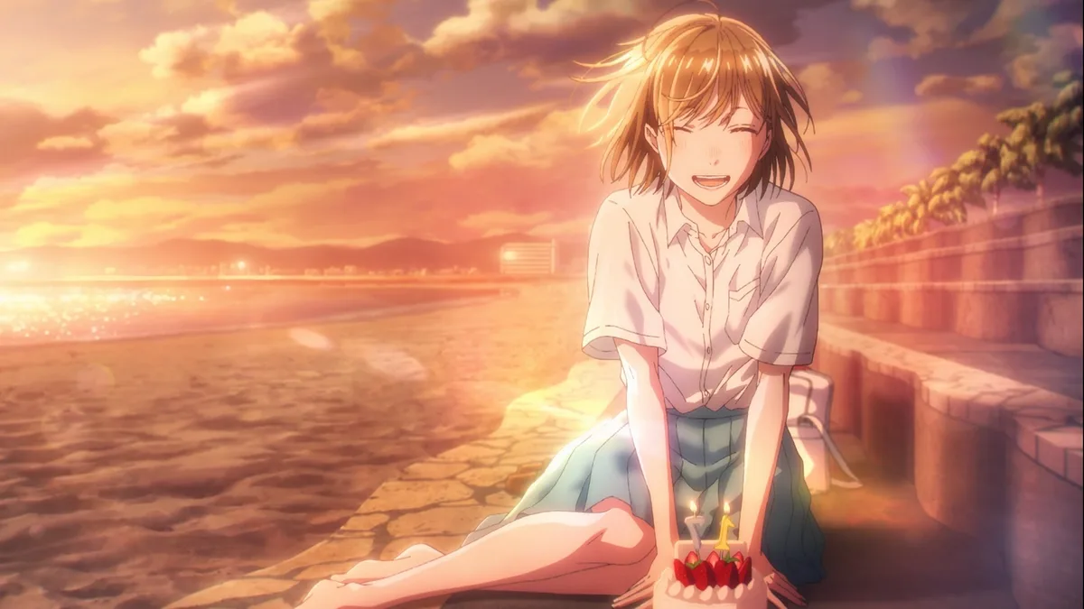 An anime girl with short brown hair sits on a stone path beside a beach at sunset, smiling joyfully while holding a small…