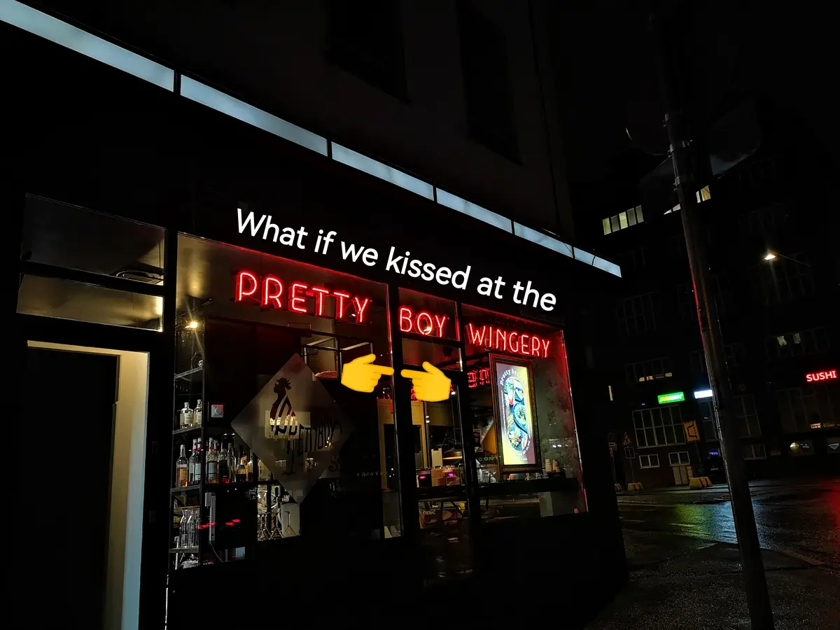 A nighttime photo of a storefront with a red neon sign reading 'PRETTY BOY WINGERY'. White text overlaid on the image reads…