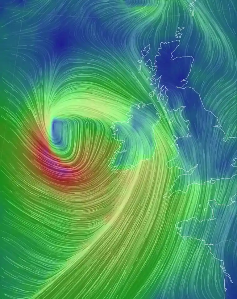 A weather map shows the United Kingdom overlaid with swirling wind patterns, with a large vortex centered near the UK…