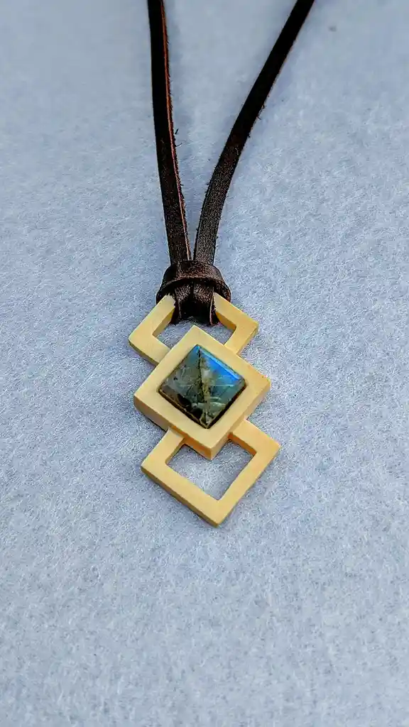 Check out my latest masterpiece crafted from woolly mammoth ivory and shimmering labradorite!